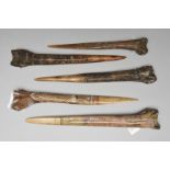 Five Abelam daggers Papua New Guinea cassowary bone, with carved stylised decoration and pigment,