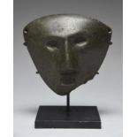 A Mezcala mask Guerrero, Mexico, circa 300 BC - 300 AD serpentine, with recessed ovoid eyes and