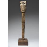 A Timor post Indonesia with four stylised bird heads to the top above bands of scroll decoration,