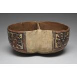 A Nazca double bowl Peru, circa 200 - 600 AD pottery, each end painted with three deity masks with