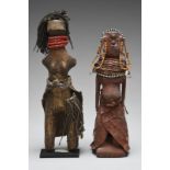 Two Karamojong dolls Kenya with coloured glass beads, fibre and hide, 20cm and 22cm high, one on a