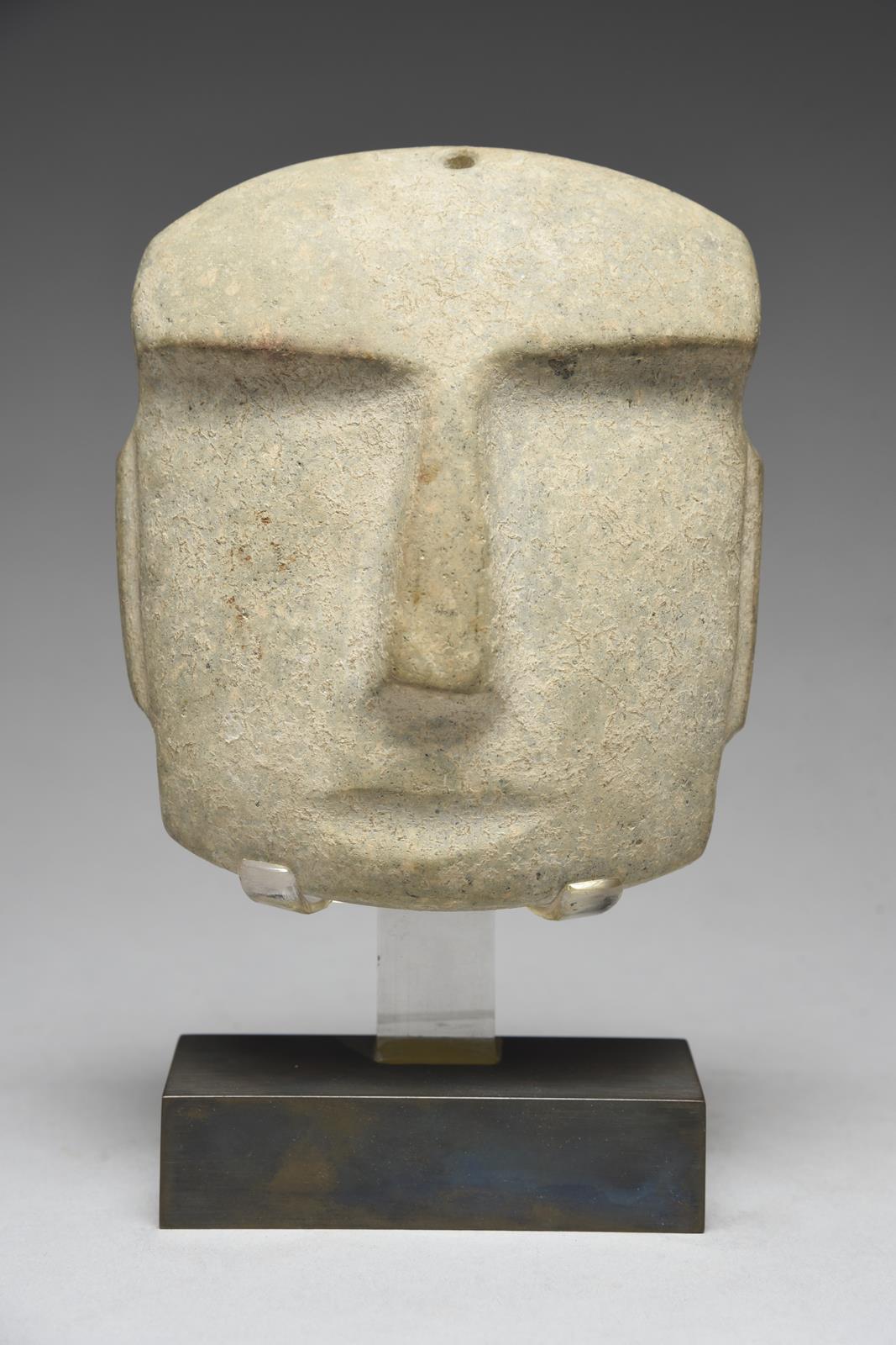 A Mezcala mask Mexico, circa 400 BC - 100 AD grey/green stone, with an overhanging brow and and