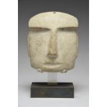 A Mezcala mask Mexico, circa 400 BC - 100 AD grey/green stone, with an overhanging brow and and