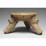 A Guanacaste Nicoya tripod bowl Costa Rica pottery, the supports with relief mythological masks