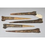 Five Abelam daggers Papua New Guinea cassowary bone, with stylised carving including faces and a