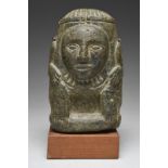 An Aztec figure Mexico stone, carved with a ribbed headdress and a feather collar with a rectangular