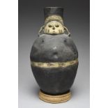 A Chancay female figural vessel Peru, circa 1100 - 1400 AD pottery, the ovoid body painted black