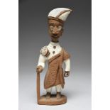 Thomas Ona. A Yoruba standing courtier figure Nigeria wearing an angled cap, a shoulder cloth and