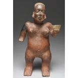 A Nayarit standing female figure Mexico, circa 300 BC - 250 AD clay, with an linear incised long
