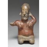 A Jalisco seated female figure Mexico, circa 100 BC - 250 AD pottery, with a cross banded headdress,