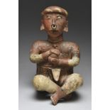 A Nayarit seated ball player Mexico, circa 100 BC - 250 AD pottery, wearing a head band, multiple