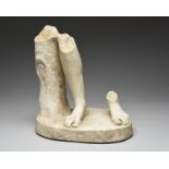 A Roman marble statue fragment circa 2nd century AD the oval base with the remains of a tree truck