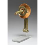 A Maya ear ornament Mexico, circa 600 - 800 AD green stone and shell, 12.5cm long, 17.5cm deep, on a