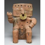A Quimbaya seated slab figure Colombia, circa 800 - 1200 AD terracotta, pierced through the top of