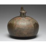 A Paracas stirrup spout vessel Peru, circa 500 - 200 BC pottery, with a globular body having