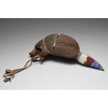 A Maasai zoomorphic headdress Kenya hide, fibre and coloured glass beads, 42cm long.