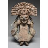 A Zapotec figure urn Mexico, circa 500 - 800 AD pottery, depicting Cocijo, seated wearing an