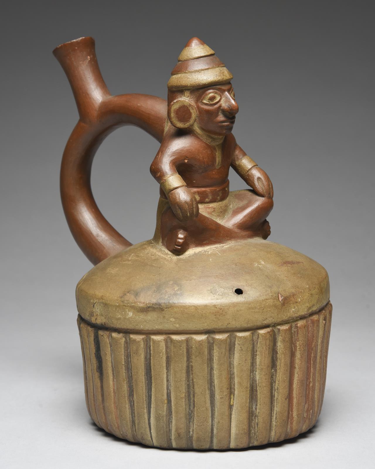 A Moche stirrup spout vessel Peru, circa 400 - 700 AD of circular ribbed form with a domed top - Image 4 of 5