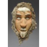 An Inuit mask Alaska hide and hair, 30cm high. Provenance Peter J. Ucko, 1938 - 2007,