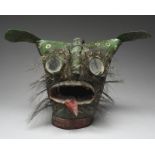 A Guerrero mask Zitlala, Mexico hide with round mirror eyes and inset bunches of hair, painted green