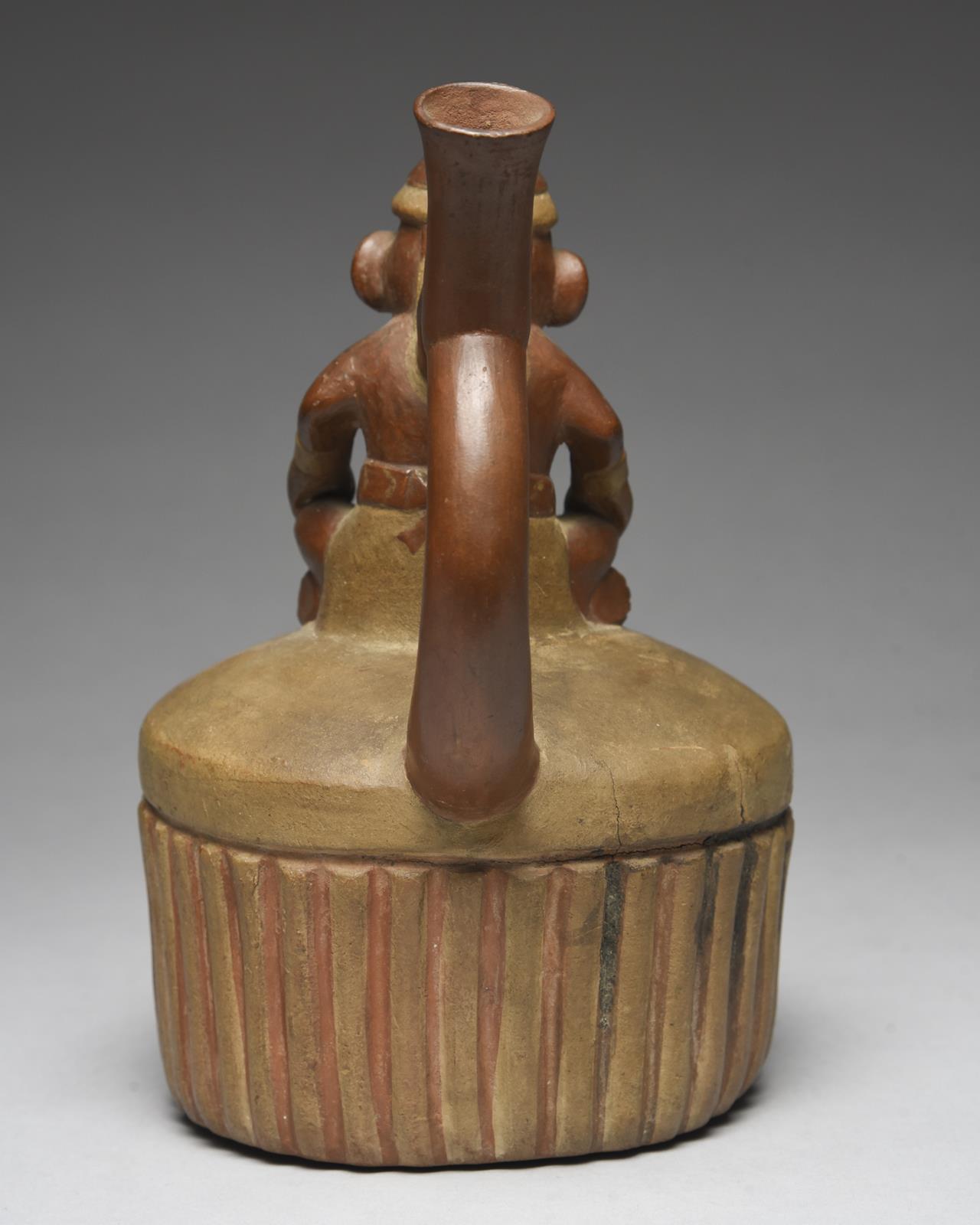 A Moche stirrup spout vessel Peru, circa 400 - 700 AD of circular ribbed form with a domed top - Image 5 of 5