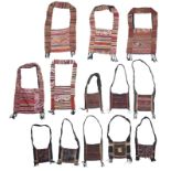 Eight Akha hill tribe bags yaam Thailand with embroidered panel fronts and three with applique seeds