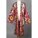 An Uzbekistan ikat jacket chapan silk and cotton with a bold and bright design and a floral