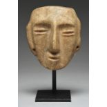 A Guerrero mask Mexico, circa 300 - 100 BC alabaster, with pierced ears and attachment holes to