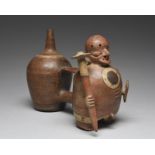 A Vicus double stirrup vessel Peru, circa 100 - 500 AD pottery, modelled as a warrior with a multi