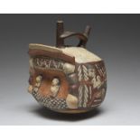 A Nazca double spout stirrup vessel Peru, circa 450 - 550 AD pottery, the front modelled as a