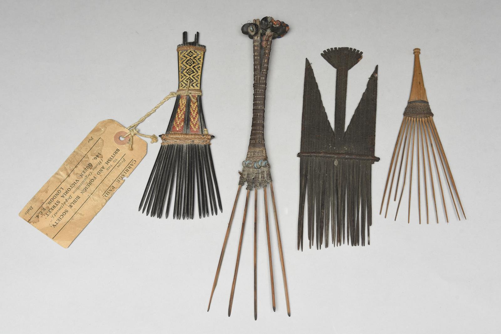 Four Melanesian combs Solomon Islands and Papua New Guinea one with red and natural fibre binding,