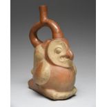 A Moche stirrup spout vessel Peru, circa 300 - 600 AD pottery, modelled as an owl with a conch shell