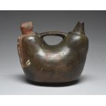 A Paracas stirrup spout whistle vessel Peru, circa 400 - 100 BC pottery, the whistle modelled around