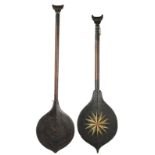 Two Suriname paddles South America one with painted a star and sun motif to each side of the