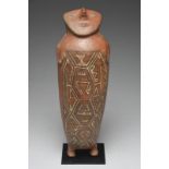An Inca hollow star gazer figure Peru terracotta with a red slip and painted detailing including the