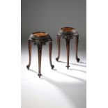 A FINE PAIR OF MAHOGANY URN STANDS IN CHIPPENDALE STYLE, 19TH CENTURY each with a circular inset