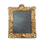A CHARLES II CARVED GILTWOOD MIRROR LATE 17TH CENTURY the rectangular plate inside a scrolling