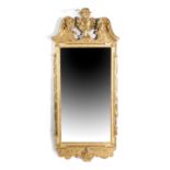 A GEORGE II GILTWOOD WALL MIRROR C.1730-40 the later bevelled, rectangular plate within a Kentian