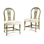 A PAIR OF GEORGE III GREEN PAINTED AND PARCEL GILT SIDE CHAIRS IN THE MANNER OF GILLOWS, C.1790