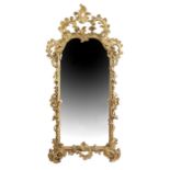 A GILTWOOD AND GESSO PIER MIRROR IN ROCOCO STYLE FRENCH OR ITALIAN, 19TH CENTURY the arched plate