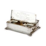 A GEORGE V PRESENTATION SILVER TREASURY INKSTAND BY CHARLES COMYNS, LONDON, 1923 of rectangular