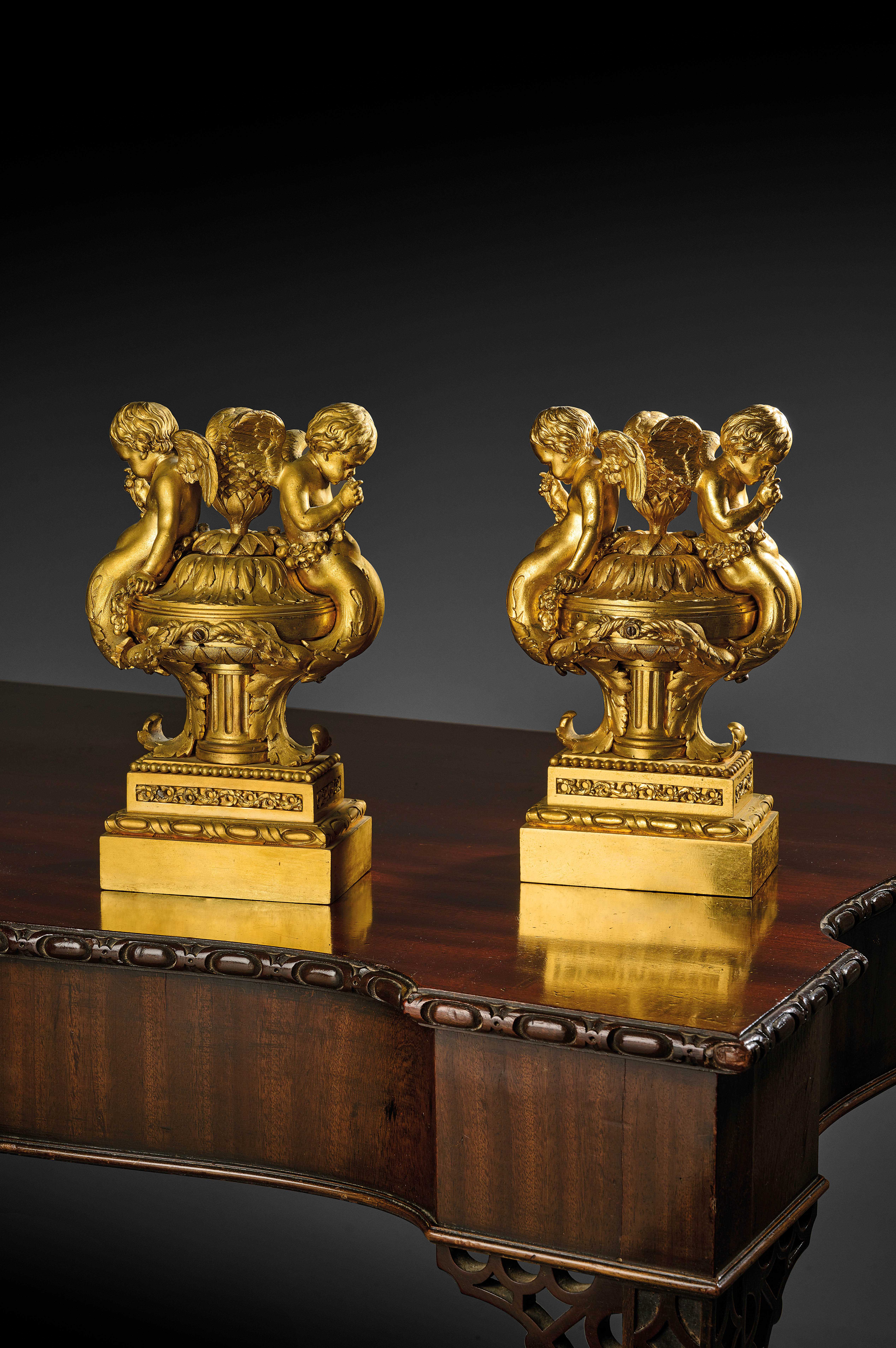 A PAIR OF FRENCH ORMOLU URNS IN LOUIS XVI STYLE IN THE MANNER OF PIERRE GOUTHIERE, 19TH CENTURY each