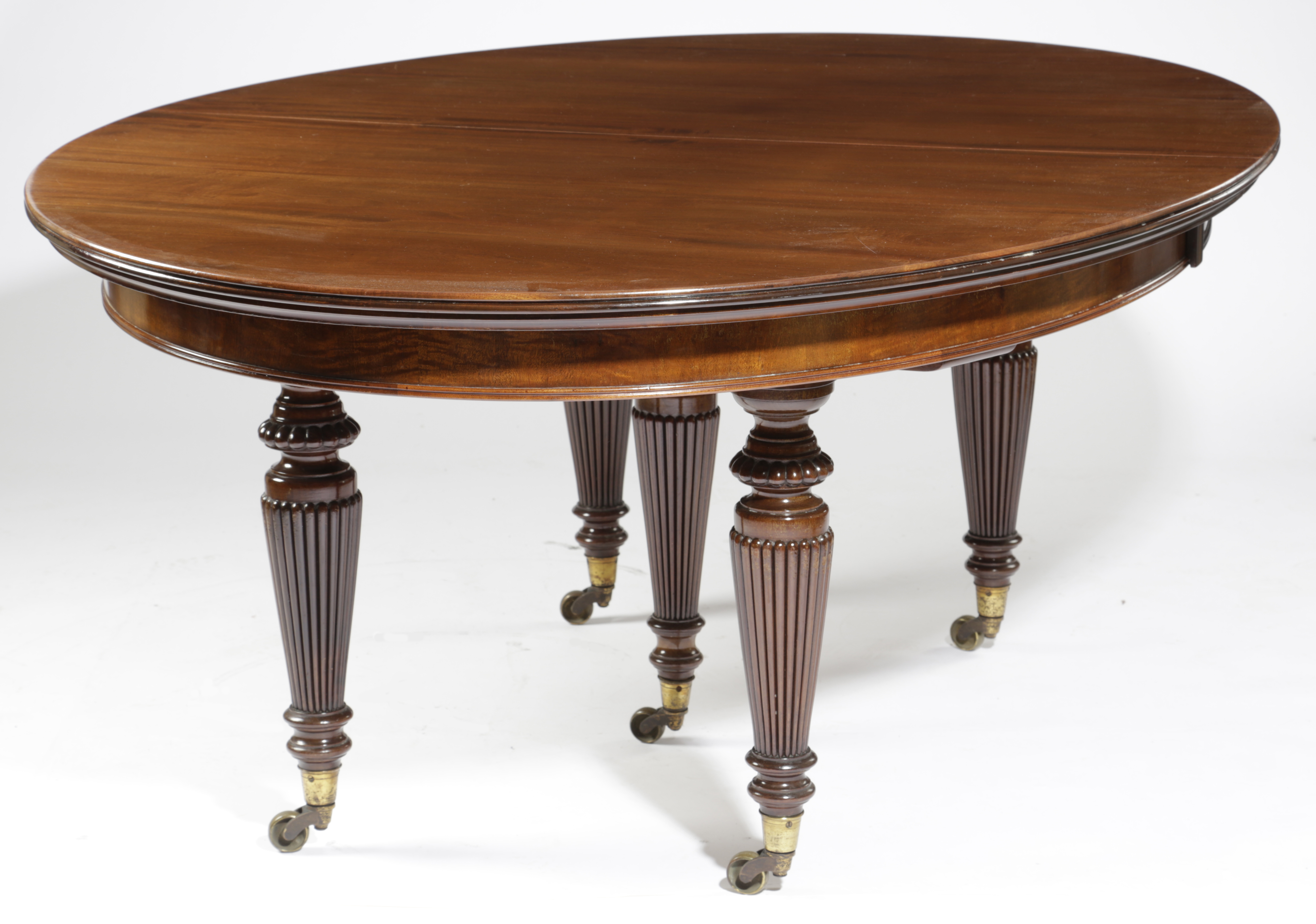 A VICTORIAN MAHOGANY DINING TABLE C.1870-80 the top with a reeded edge with rounded ends extending - Image 2 of 3