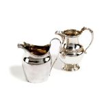 A GEORGE III SILVER CREAM JUG LONDON, 1797 maker's mark worn, of oval form, with a scroll handle and