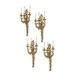 A RARE SET OF FOUR FRENCH ORMOLU 'AUX CORS DE CHASSE' WALL LIGHTS IN LOUIS XVI STYLE AFTER A MODEL