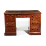 A GEORGE IV MAHOGANY TWIN PEDESTAL DESK C.1825 the moulded edge top inset with a gilt tooled leather