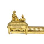 A FRENCH ORMOLU FENDER IN LOUIS XVI STYLE, 19TH CENTURY the chenet ends modelled with a boy and a