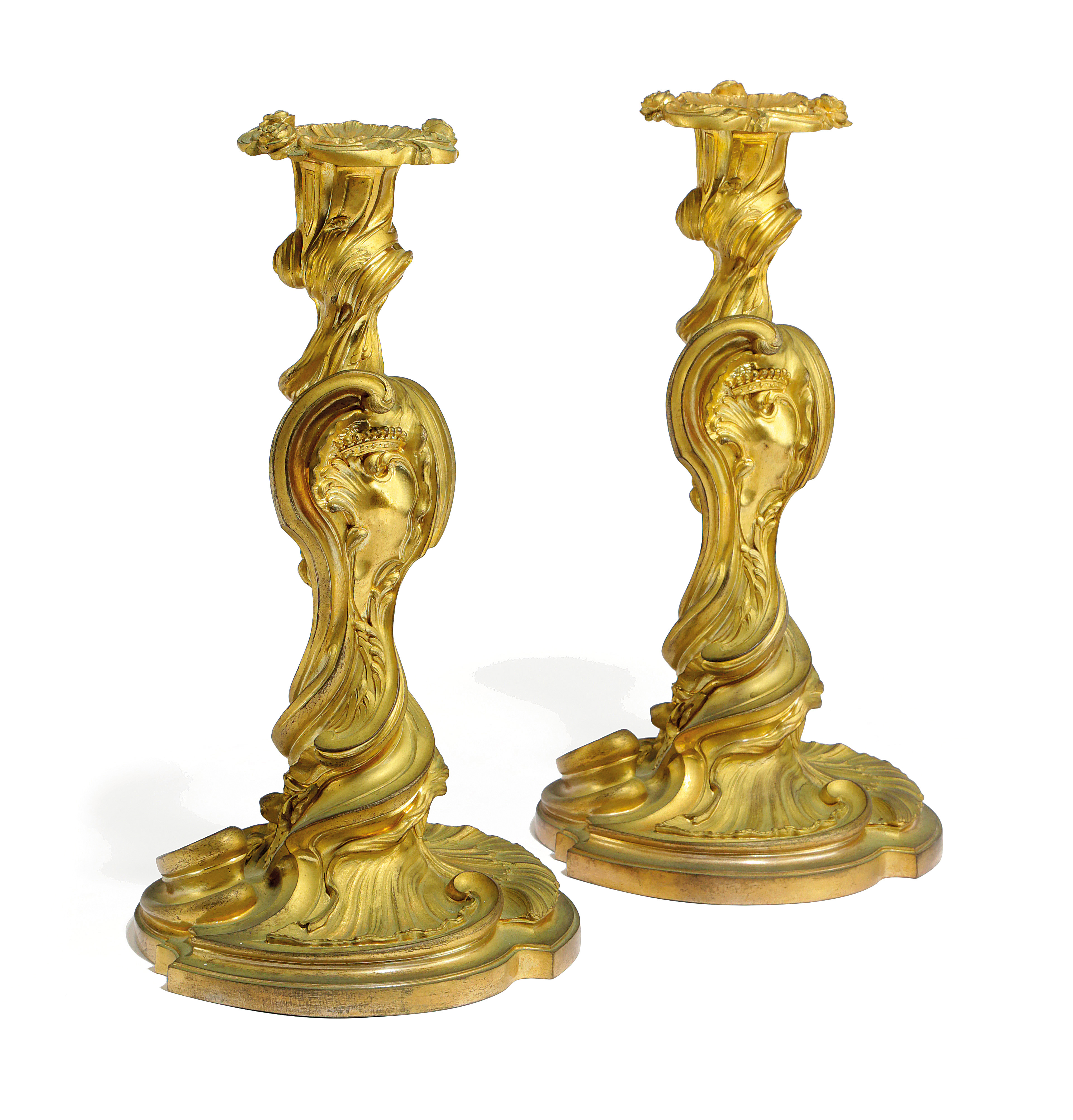 A PAIR OF FRENCH ORMOLU CANDLESTICKS IN LOUIS XV STYLE AFTER A DESIGN BY JUSTE-AURELE MEISSONNIER (
