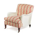 AN EDWARDIAN EASY ARMCHAIR BY HOWARD & SONS, EARLY 20TH CENTURY with Howard floral and red stripe