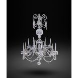 A LARGE CUT-GLASS TWELVE LIGHT CHANDELIER IN GEORGE III STYLE, 19TH CENTURY the faceted ovoid